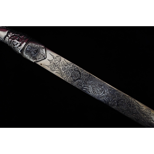 281 - A Victorian silver paper knife with embossed weighted handle and allover engraved floral, leaf and s... 