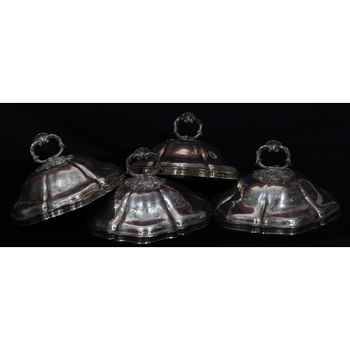 285 - A set of 4 Georgian silver round scallop shaped tureen covers with fish, scroll and shell handles on... 