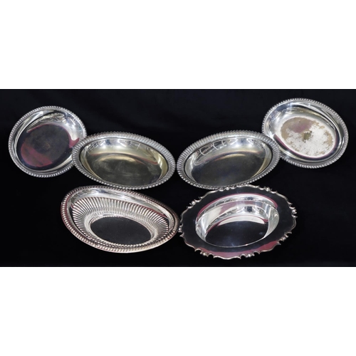 287 - A pair of silver plated oval entrée dishes with covers, embossed scallop shaped rim and allover engr... 