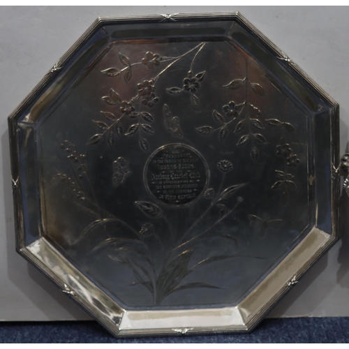 289 - An Elkington & Co silver plated octagonal shaped salver with inscription to centre, allover raised b... 