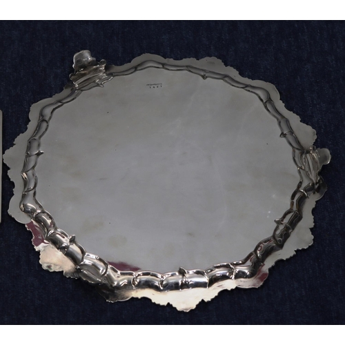 289 - An Elkington & Co silver plated octagonal shaped salver with inscription to centre, allover raised b... 