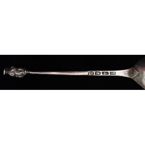 302 - A George III Apostle sealed topped spoon with hammered bowl, London 1774, maker's mark GS? in script... 