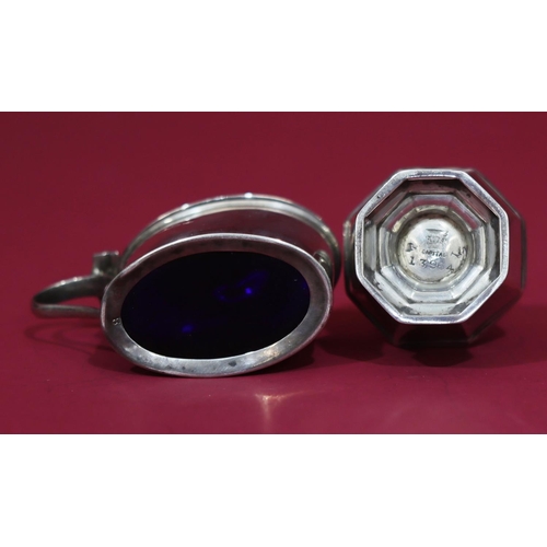 308 - A Birmingham silver oval mustard pot with hinged lid and blue glass liner, a Sheffield silver octago... 