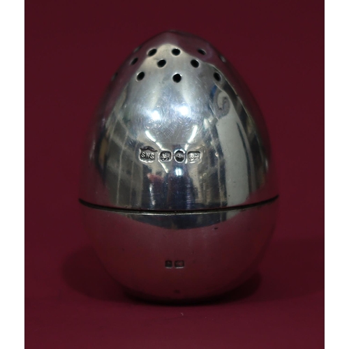 310 - A Victorian novelty silver weighted pepper pot in the form of an egg, 5.2cm high, 2.4oz (slight dent... 