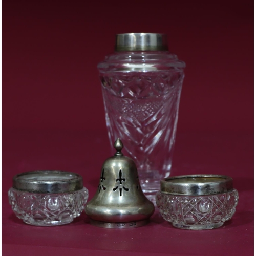 312 - A cut glass round sugar caster with Birmingham silver lid, 16.5cm high, a pair of cut glass round bu... 