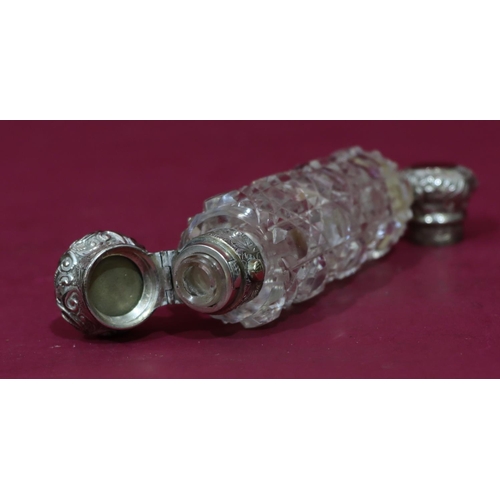 316 - A 19th Century cut glass cylindrical double-ended scent bottle, screw and hinged lids with embossed ... 