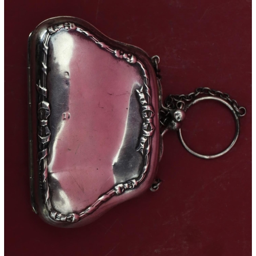 318 - A silver ladies' evening purse with chain, hinged centre enclosing red water silk interior (some den... 