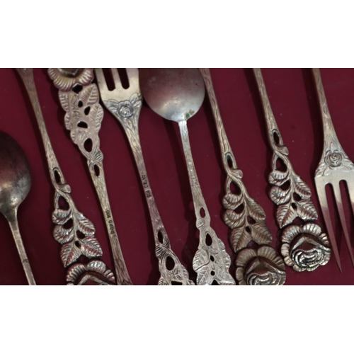 322 - A set of 6 800 silver coloured metal small forks with floral handles, 6 Continental silver coloured ... 