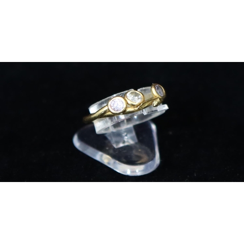 335 - An 18ct gold ladies' 3-stone ring set with clear stones, Size M, overall weight 2 grams gross