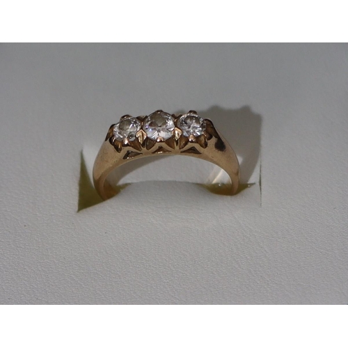 344 - A high carat gold 3-stone diamond ring (centre diamond approx. 0.20ct) flanked by 2 smaller diamonds... 