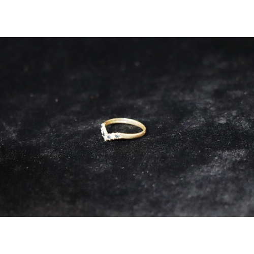 348 - A 9ct gold ladies' wishbone ring set with 4 sapphires and 3 small diamonds, Size N, 1.3 grams gross