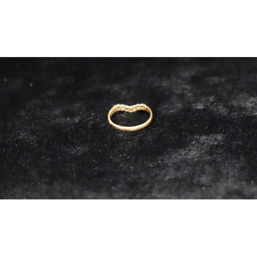 348 - A 9ct gold ladies' wishbone ring set with 4 sapphires and 3 small diamonds, Size N, 1.3 grams gross