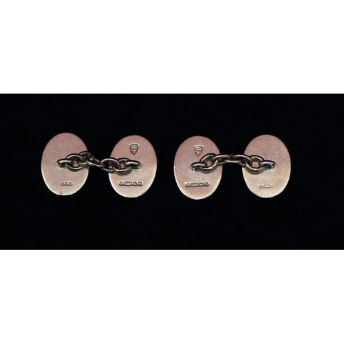 352 - A pair of 9ct gold oval gentlemen's cufflinks with chased scroll decoration, 11.8 grams