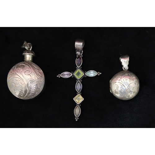 354 - A 925 silver cross set with various coloured stones, a 925 silver bottle shaped scent bottle pendant... 