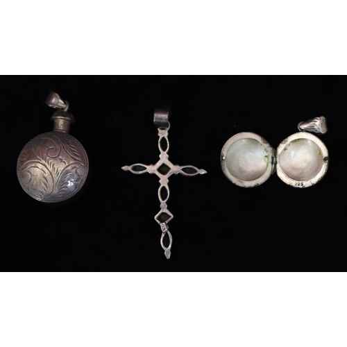 354 - A 925 silver cross set with various coloured stones, a 925 silver bottle shaped scent bottle pendant... 