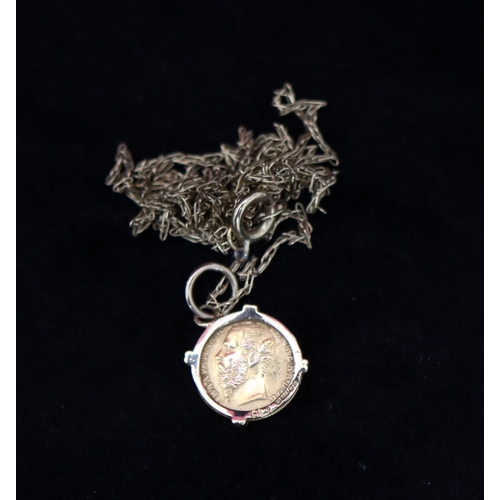 356 - A small gold Mexican coin set in a pendant, with 9ct gold chain, overall weight 1.5 grams