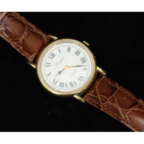 357 - A ladies' Longines circular quartz wristwatch with cream dial and Roman numerals, brown leather stra... 