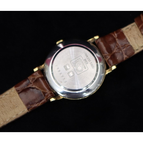 357 - A ladies' Longines circular quartz wristwatch with cream dial and Roman numerals, brown leather stra... 