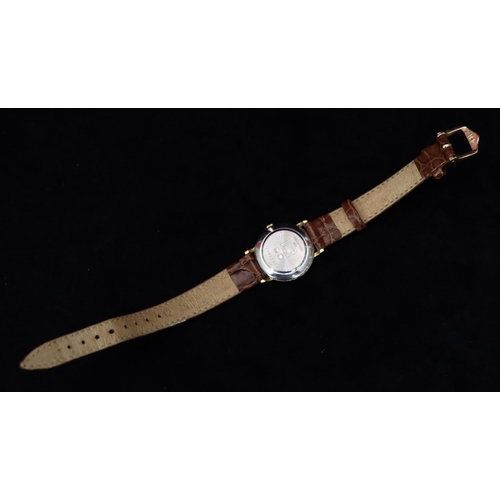 357 - A ladies' Longines circular quartz wristwatch with cream dial and Roman numerals, brown leather stra... 