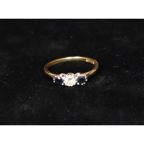 358 - An 18ct gold ladies' 3-stone ring set with centre diamond flanked by 2 sapphires (diamond approx. 0.... 