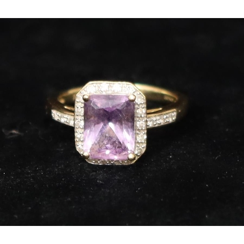 359 - A 9ct gold ladies' ring set with centre purple stone surrounded by small diamond chips, Size M/N, 3 ... 