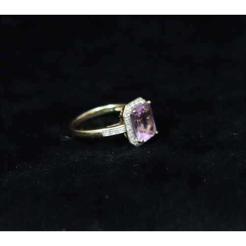 359 - A 9ct gold ladies' ring set with centre purple stone surrounded by small diamond chips, Size M/N, 3 ... 