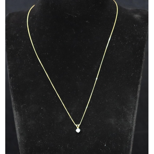 362 - An 18ct gold pendant set with a diamond, approx. 0.50ct, with silver gilt chain