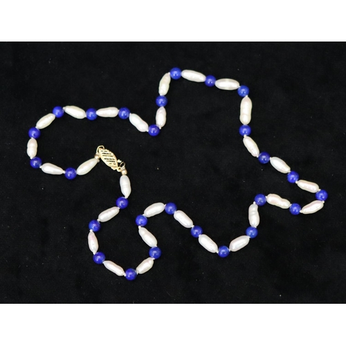 364 - A freshwater pearl and Lapis Lazuli bead necklace with 14ct gold clasp, 44.5cm long