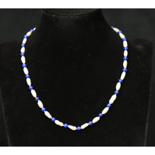 364 - A freshwater pearl and Lapis Lazuli bead necklace with 14ct gold clasp, 44.5cm long