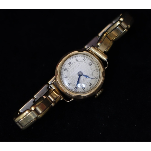 368 - A 9ct gold circular wristwatch with silver dial and Arabic numerals, expanding strap bracelet, weigh... 