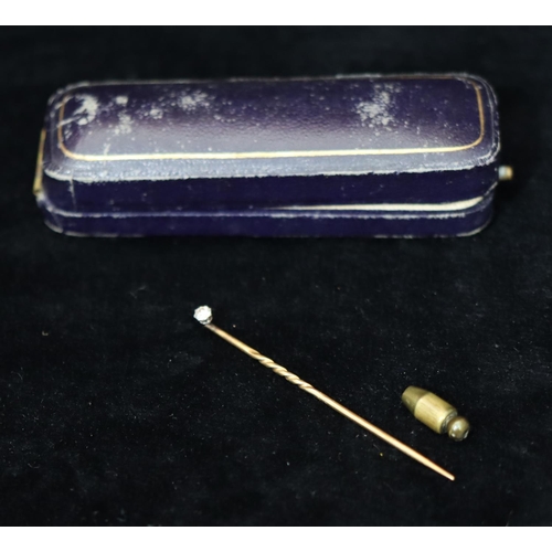 369 - A gold stick pin mounted with small solitaire diamond (cased)