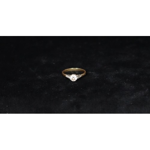 381 - A gold solitaire diamond ring, approx. 0.60ct, set with 6 small diamonds to shoulders, Size 0, 2.5 g... 