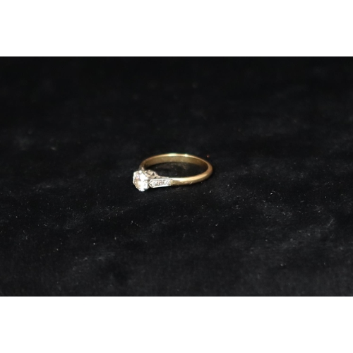 381 - A gold solitaire diamond ring, approx. 0.60ct, set with 6 small diamonds to shoulders, Size 0, 2.5 g... 