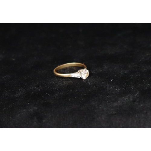 381 - A gold solitaire diamond ring, approx. 0.60ct, set with 6 small diamonds to shoulders, Size 0, 2.5 g... 