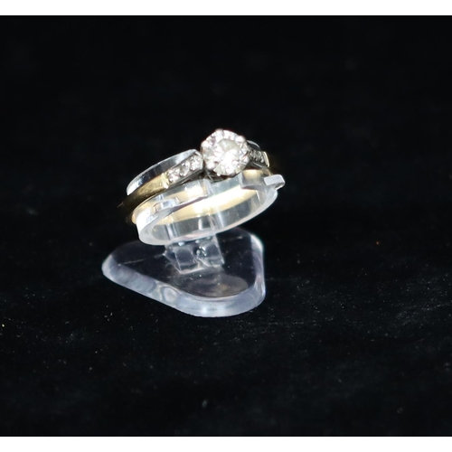 381 - A gold solitaire diamond ring, approx. 0.60ct, set with 6 small diamonds to shoulders, Size 0, 2.5 g... 