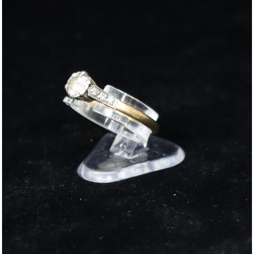 381 - A gold solitaire diamond ring, approx. 0.60ct, set with 6 small diamonds to shoulders, Size 0, 2.5 g... 