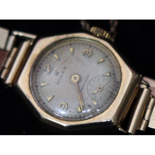 390 - A 9ct gold ladies' Rolex wristwatch with circular dial, seconds dial and 9ct gold strap bracelet (wi... 