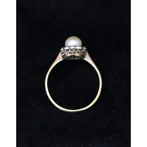 391 - An 18ct gold cluster ring set with centre pearl, surrounded by 10 diamonds, Size R, 2.6 grams