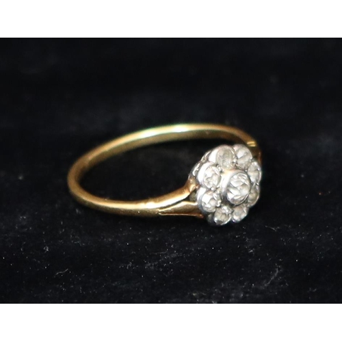 392 - An 18ct gold cluster ring set with centre diamond, surrounded by 8 smaller diamonds, Size R, 2.5 gra... 