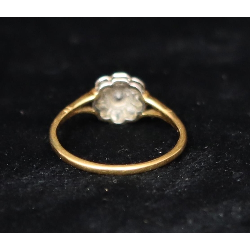 392 - An 18ct gold cluster ring set with centre diamond, surrounded by 8 smaller diamonds, Size R, 2.5 gra... 