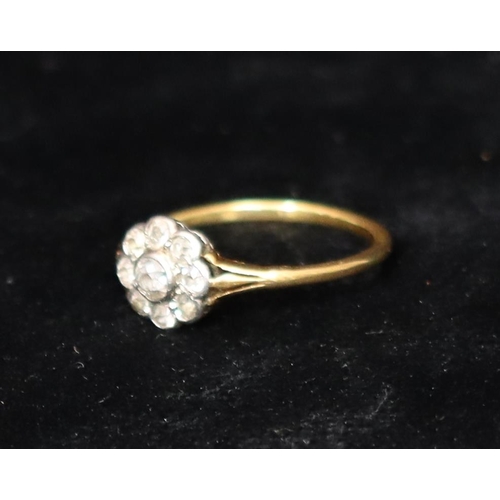 392 - An 18ct gold cluster ring set with centre diamond, surrounded by 8 smaller diamonds, Size R, 2.5 gra... 