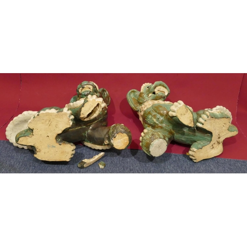 4 - A pair of Oriental green glazed earthenware figures of Dogs of Foo, 53.5cm high, 68cm wide (slight d... 