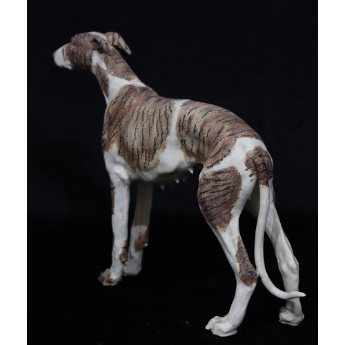 40 - A Studio glazed earthenware china figure of a standing greyhound (tail a/f), 32.5cm high