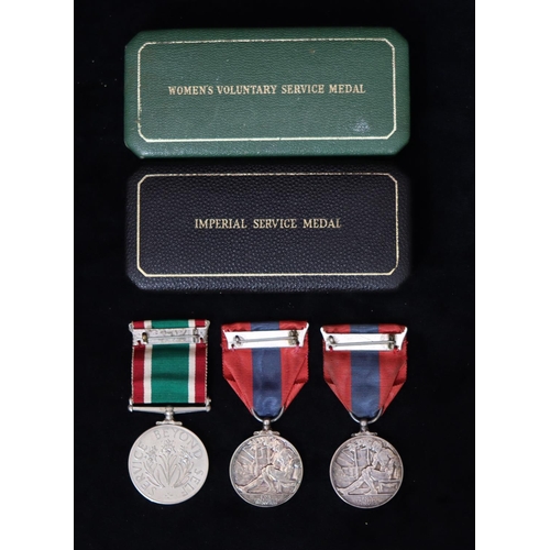 404 - 2 Elizabeth II Imperial Service medals (1 boxed) and a Woman's Voluntary Service medal (boxed) (3)