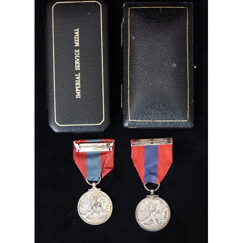 405 - A George V Imperial Service medal (cased) and an Elizabeth II Imperial Service medal (cased) (2)