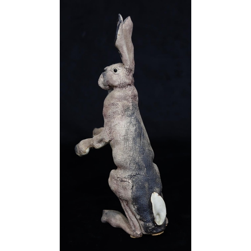41 - A Studio glazed earthenware figure of a standing hare with embossed monogram, 33.5cm high