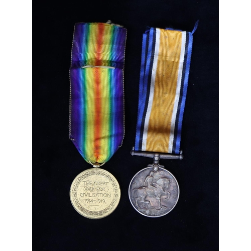 410 - A pair of WWI Military medals, 1914-18 medal and a war medal 