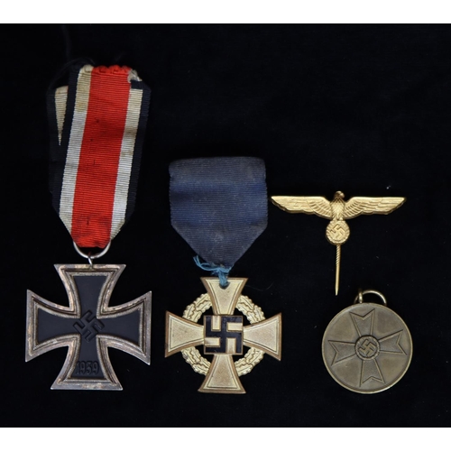 411 - A 1939 German WWII Iron Cross Second Class with ribbon, a German Faithful Service Decoration medal, ... 