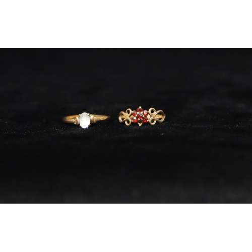 437 - A 9ct gold ladies' small cluster ring set with red stones, Size K/L, a ladies' ring set with pale bl... 