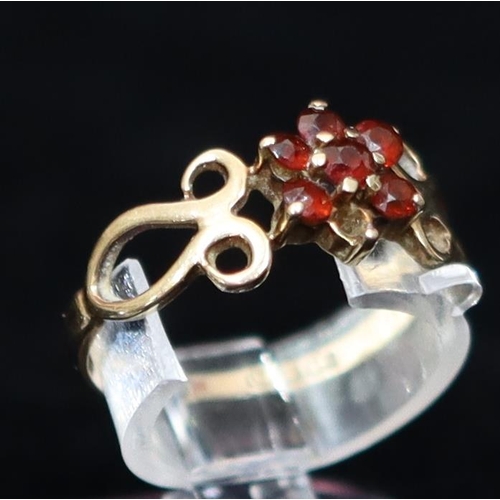 437 - A 9ct gold ladies' small cluster ring set with red stones, Size K/L, a ladies' ring set with pale bl... 